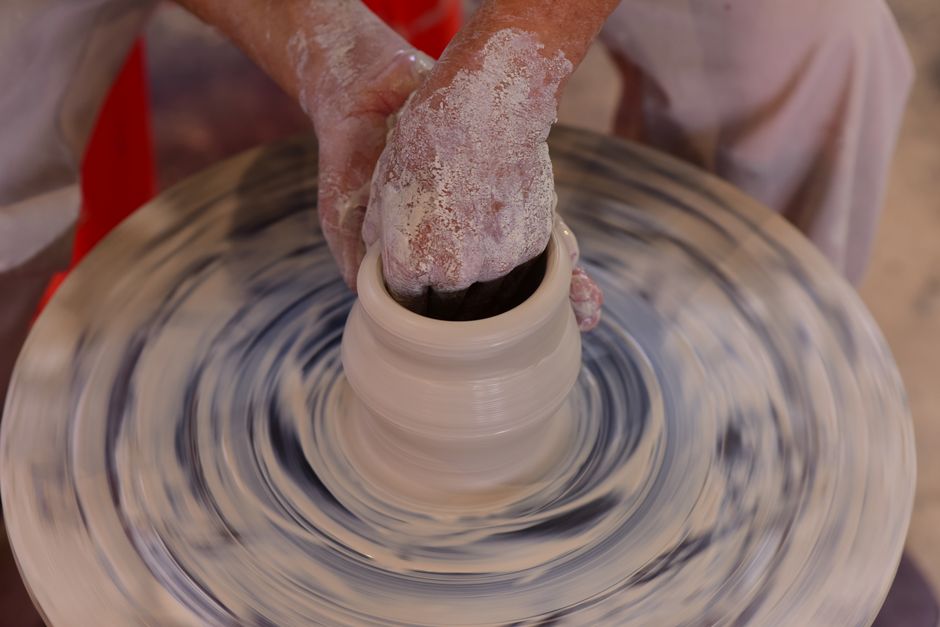 Pottery hands shaping clay